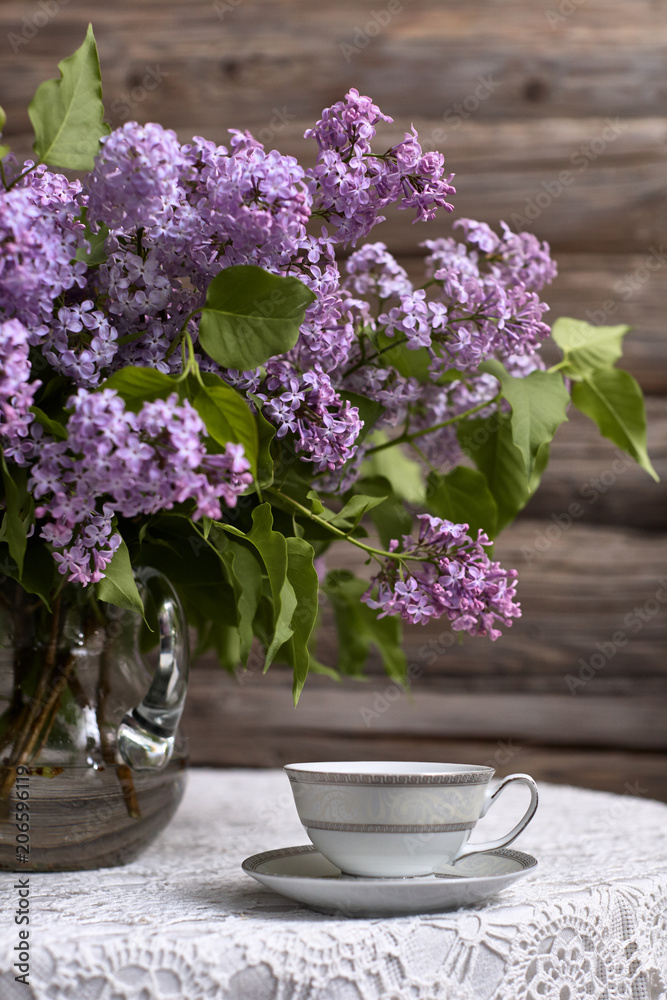 Bouquet of lilac and a cup of tea./Flower, Tea - Hot Drink, Picture Frame, Lilac - Flower, Tea Cup Bouquet of lilac and a cup of tea./Flower, Tea - Hot Drink, Picture Frame, Lilac - Flower, Tea Cup