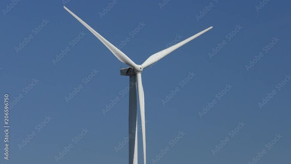 Wind turbine against the blue sky. Wind turbine against the blue sky.