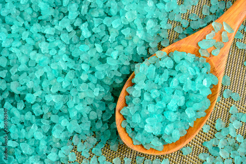 Sea salt turquoise in a wooden spoon closeup