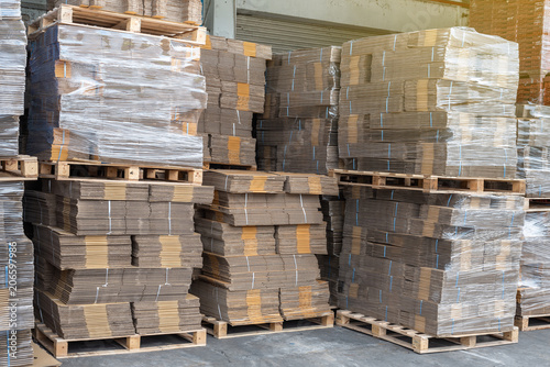 Cardboard boxes on wooden pallet in warehouse