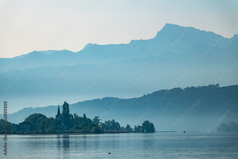 Foggy morning landscape on the shores of the Obersee (Upper Lake Zurich) , Switzerland