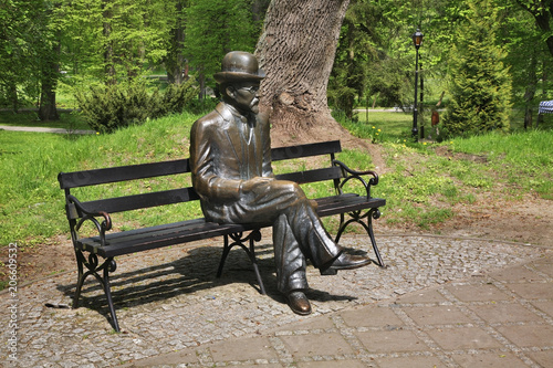 Bench of Boleslaw Prus at Spa park in Naleczow. Swietokrzyskie Voivodeship. Poland photo