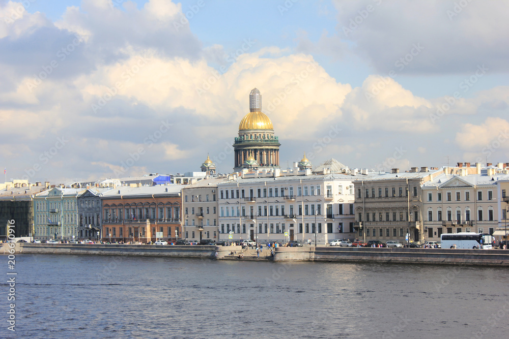 Isaac's Cathedral and Historic Buildings Architecture in St. Petersburg, Russia. Cityscape View with Antique Classic House Fronts on Summer Day Scene, View Over the Neva River.