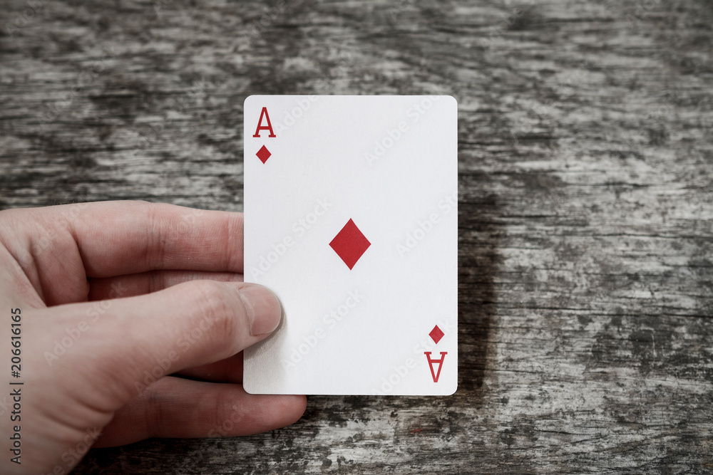ace of diamond man holding playing card