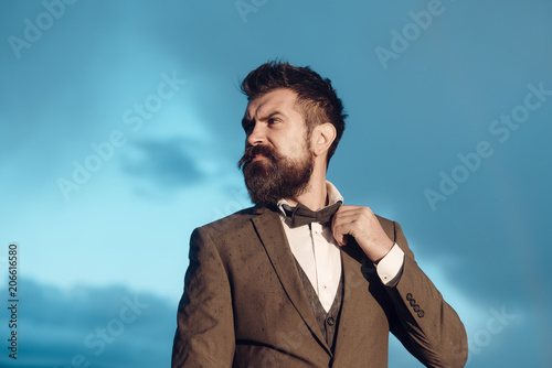 Hipster, bearded man on cloudy sky. Wanderlust, vacation and travel