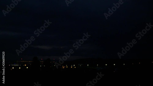 big storm and lightning over the night city