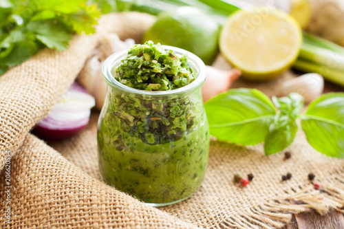 Green sauce in a glass jar
