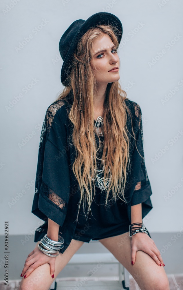 Portrait of beautiful young woman with makeup in black hat Portrait of beautiful young woman with makeup in black hat