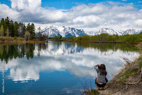 Taking a photograph of a Perfect Mountain and River Setting