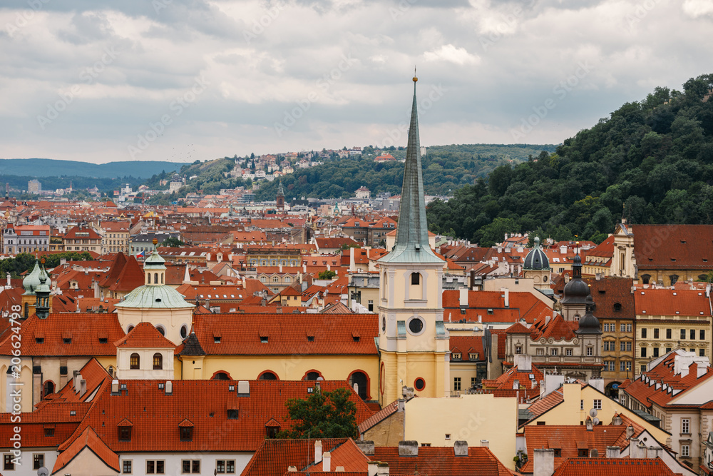 Czech Republic, Prague, July 25, 2017: Panoramic view of the city. Red Roofs of houses and structures of the old city in the summer in cloudy cloudy weather