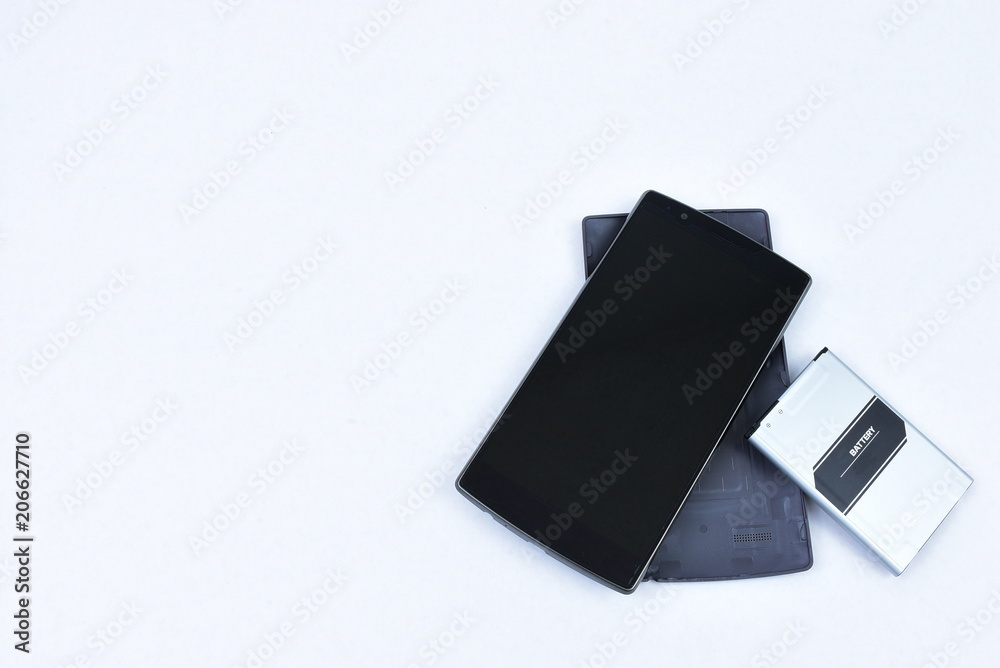 cell phone with battery removed, high key, room for text
