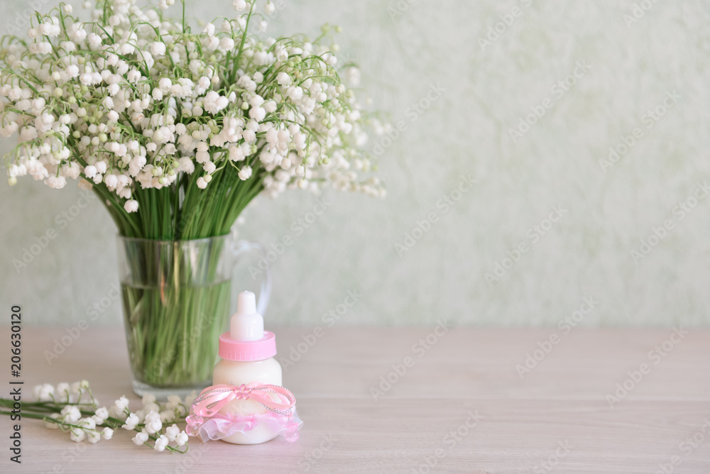 decorative baby bottle with milk are on the table. For a baby shower celebrate. for thematic birthday decor
