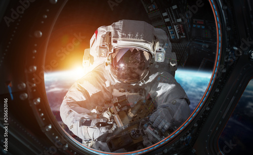 Fototapeta Naklejka Na Ścianę i Meble -  Astronaut working on a space station 3D rendering elements of this image furnished by NASA