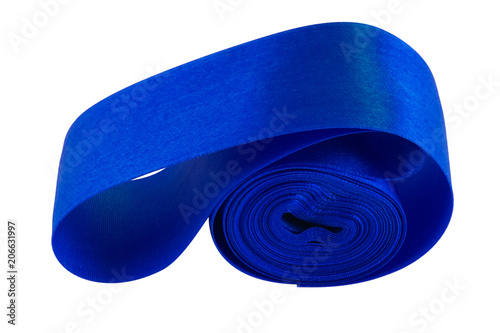 A blue satin ribbon, laid in the form of a roll with a bent inside end on a white background. photo