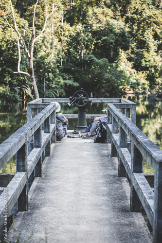 Two travelers resting on the pier