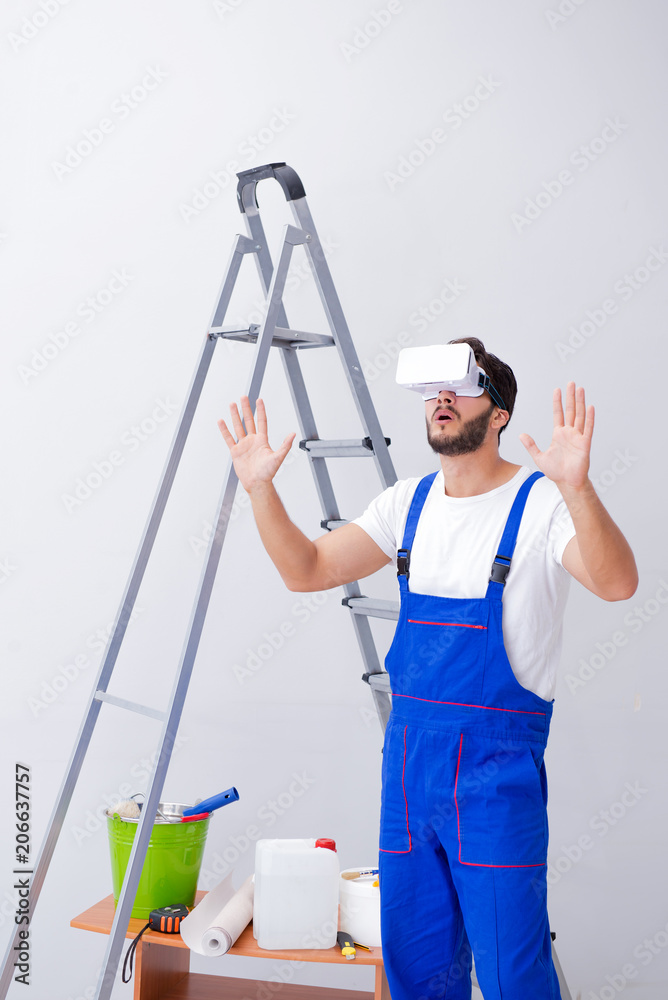 Man with VR glasses gluing wallpaper Man with VR glasses gluing wallpaper
