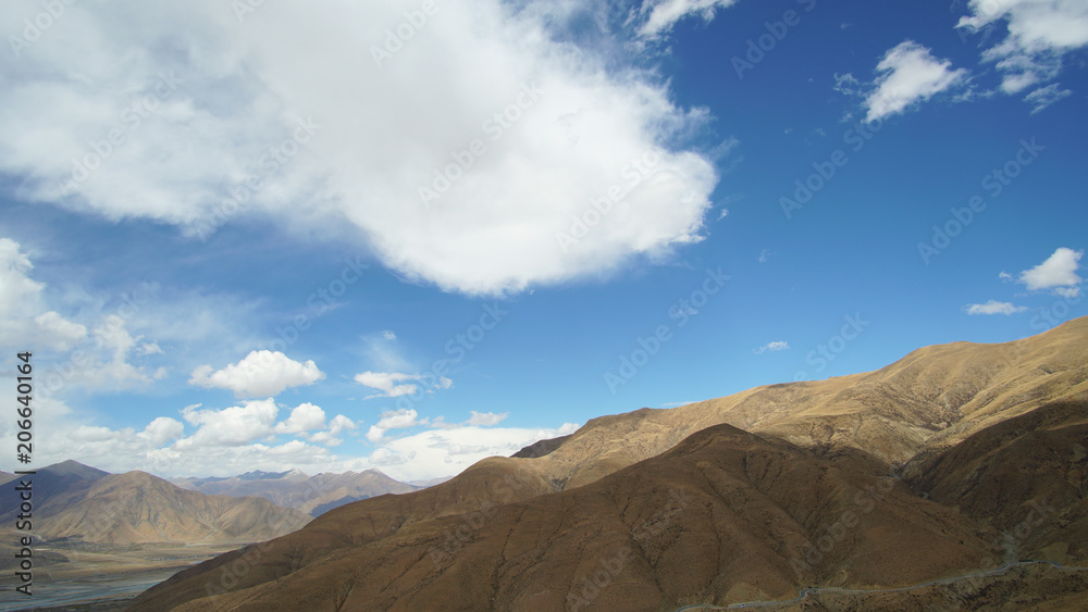 Fototapeta premium Mountain with some cloud on the blue clear sky