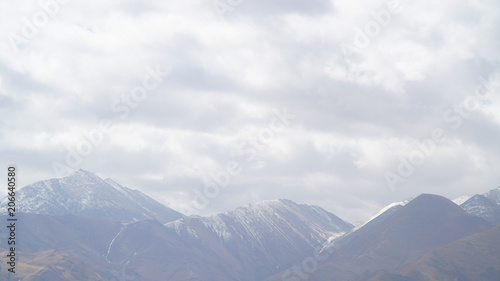 Mountain with some cloud on the blue clear sky