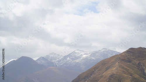 Mountain with some cloud on the blue clear sky