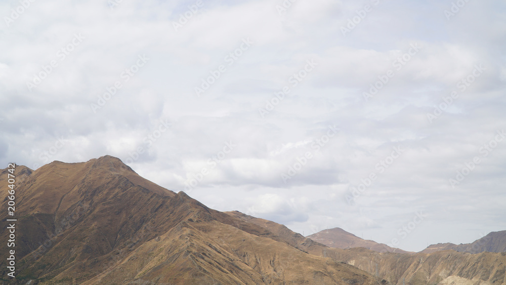 Mountain with some cloud on the blue clear sky