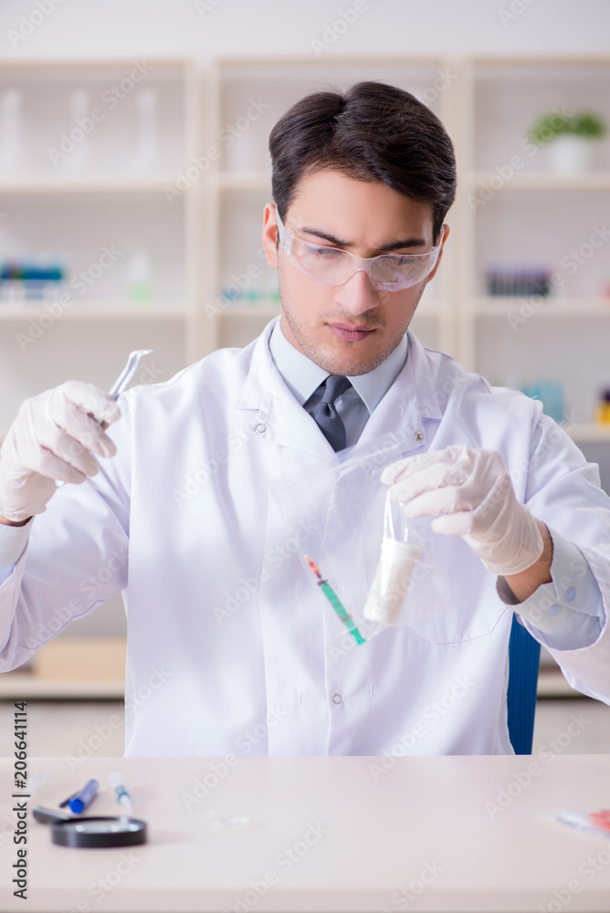 Expert criminologist working in the lab for evidence