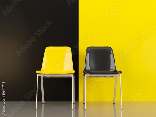 Two chairs in front of black and yellow wal photo