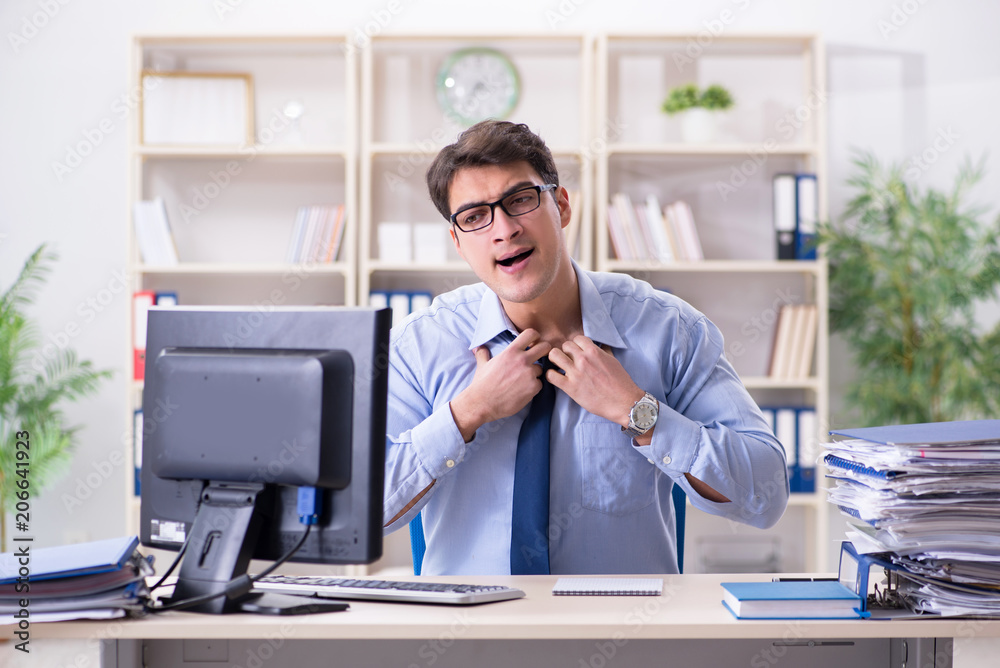 Tired businessman with too much paperwork