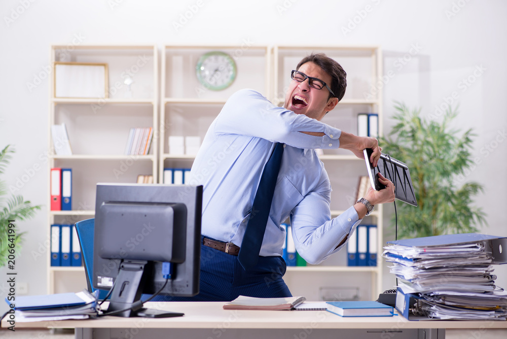 Angry businessman frustrated with too much work Angry businessman frustrated with too much work