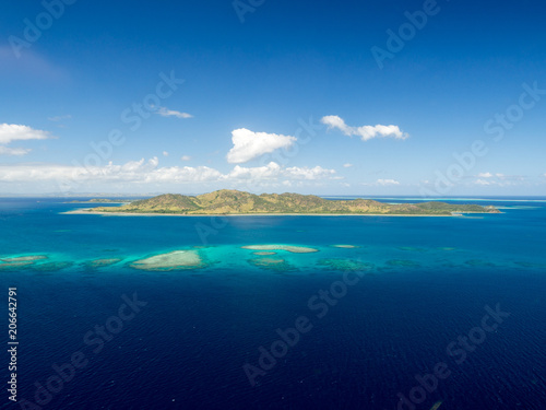 Aerial Landscape View of Tropical South Pacific Island Surrounded by White Sand Beach, Ocean and Reef in Fiji