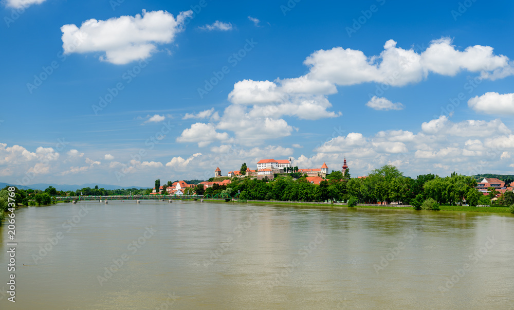 Ptuj, Slovenia, panoramic shot of oldest city in Slovenia with a castle overlooking the old town from a hill, clouds time lapse Ptuj, Slovenia, panoramic shot of oldest city in Slovenia with a castle overlooking the old town from a hill, clouds time lapse