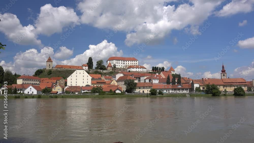 Ptuj, Slovenia, panoramic shot of oldest city in Slovenia with a castle overlooking the old town from a hill, clouds time lapse Ptuj, Slovenia, panoramic shot of oldest city in Slovenia with a castle overlooking the old town from a hill, clouds time lapse