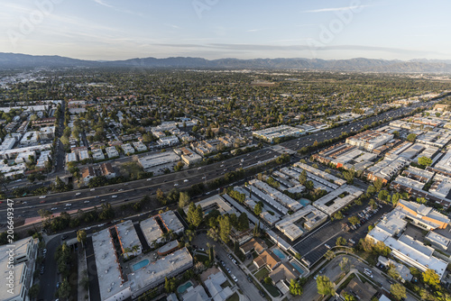 Aerial view of Encino homes, apartments and the Ventura 101 in the San Fernando Valley area of Los Angeles, California. 