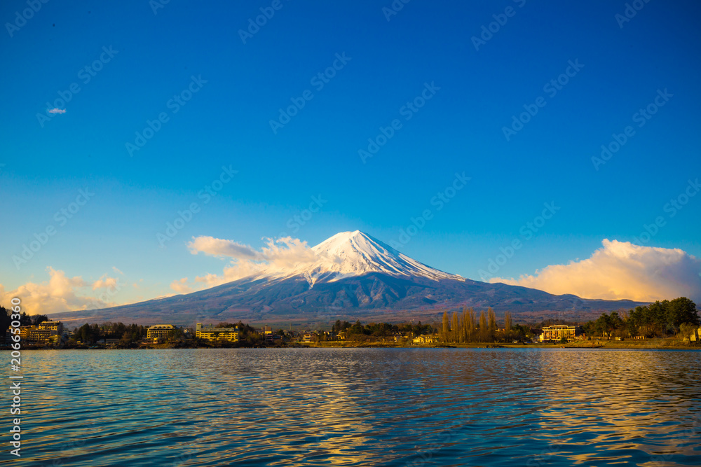 Fuji mountain outstanding along Kawaguchigo lake view with snow blue sky morning