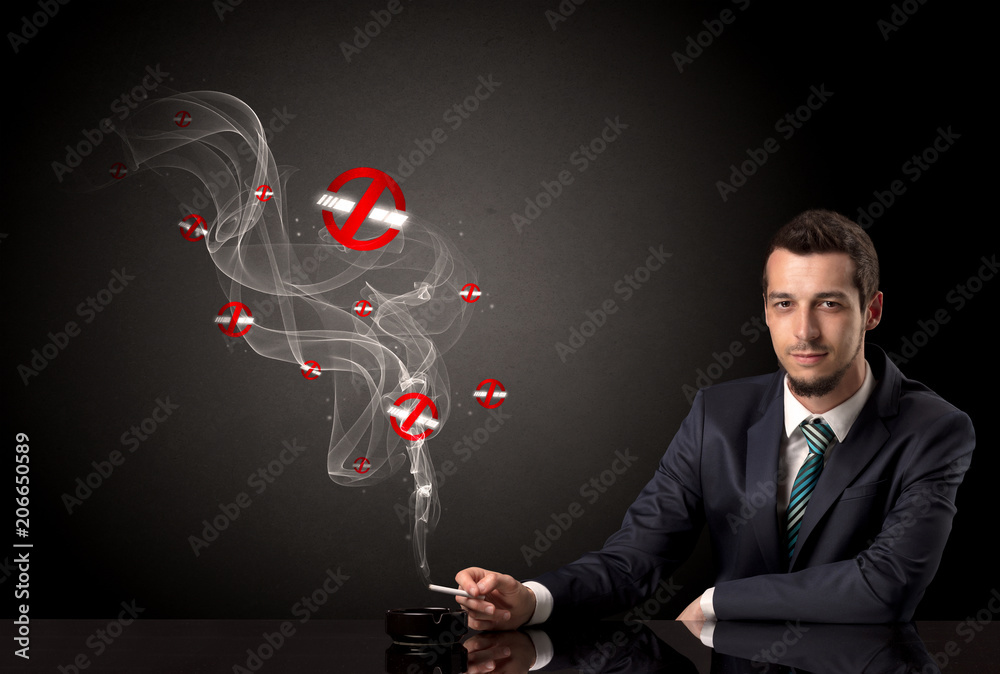 Businessman smoking with colored no smoking symbols nearby. Businessman smoking with colored no smoking symbols nearby.