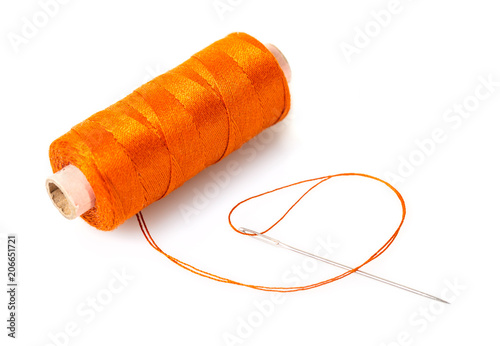 spool of thread with a needle