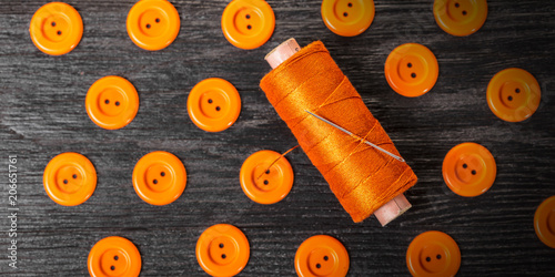 spool of threads and buttons