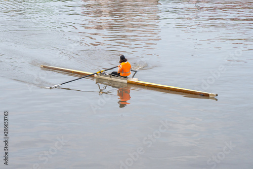 Young sportsmen in a boat, rowing on the river Rioni, Poti, Georgia