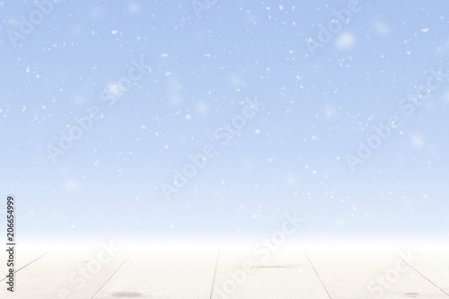 snow falling and wooden table winter season background