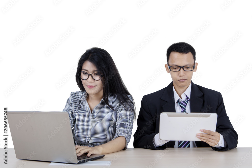 Two business people working together in the studio Two business people working together in the studio