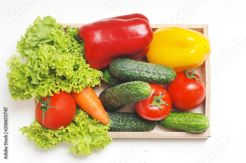 Fresh Summer Vegetables in Wooden Box Isolated. Organic Vegetables Vegetarian Vegan Health food Eatting