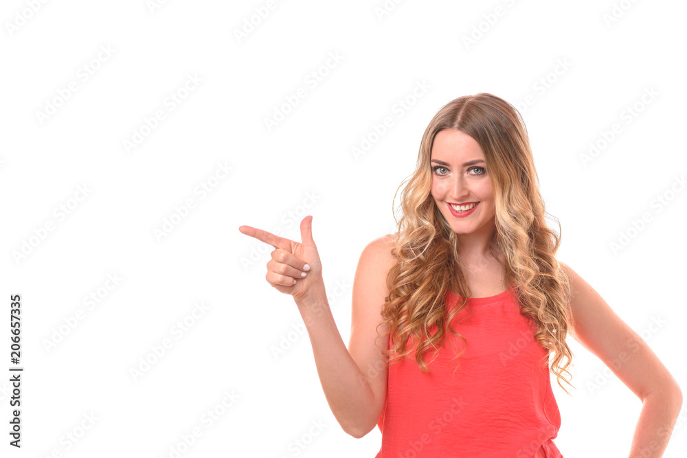 Smiling friendly woman pointing to copy space Smiling friendly woman pointing to copy space