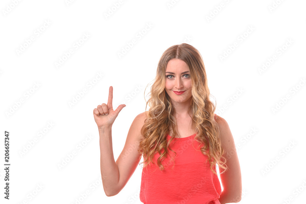 Young smiling blonde woman counting with fingers Young smiling blonde woman counting with fingers