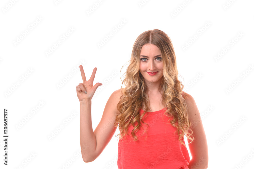 Young smiling blonde woman counting with fingers Young smiling blonde woman counting with fingers