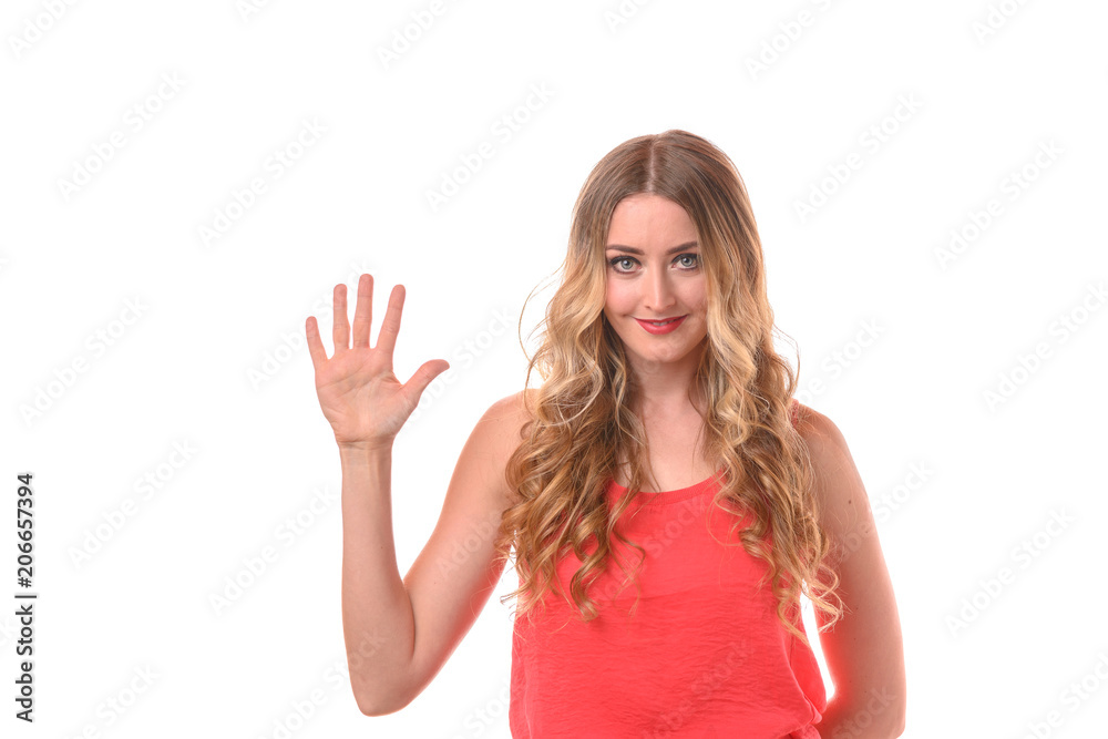 Young smiling blonde woman counting with fingers