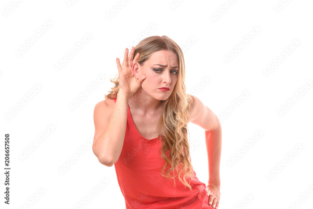 Young woman holding her hand to her ear