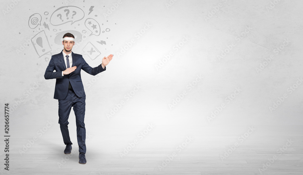 Young businessman in suit fighting with doodled symbols concept
Young businessman in suit fighting with doodled symbols concept