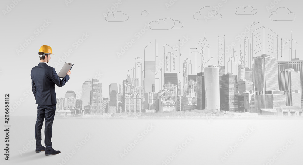 Young supervisor architect standing and replanning a big city panorama
Young supervisor architect standing and replanning a big city panorama