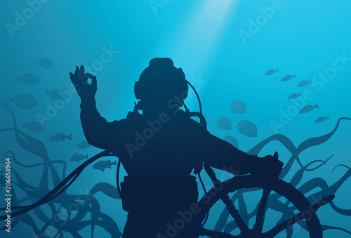 Diver with ship's steering wheel showing OK sign under water 