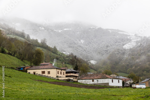 Trascastro, in Asturias, with the summits of the mountains covered by the snow of spring