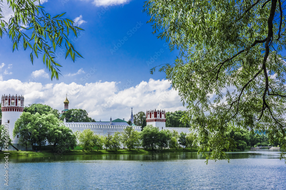 Obraz premium Monastery on the shore of the pond